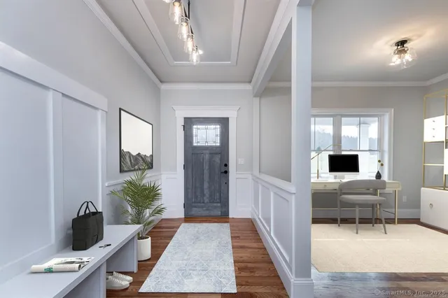 a living room with furniture and wooden floor