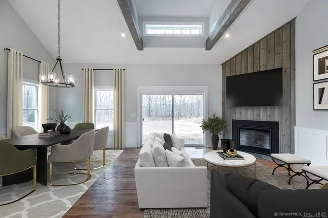a living room with furniture fireplace and a flat screen tv