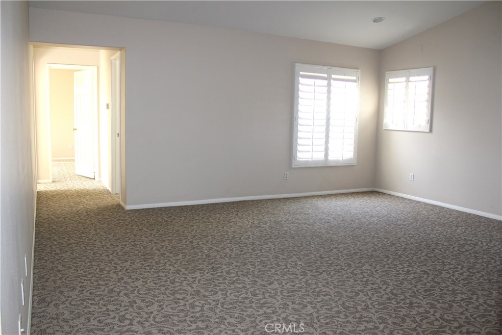 7881 Margaux Place Rancho Cucamonga, CA 91739 - Photo 14 of 41 an empty room with windows