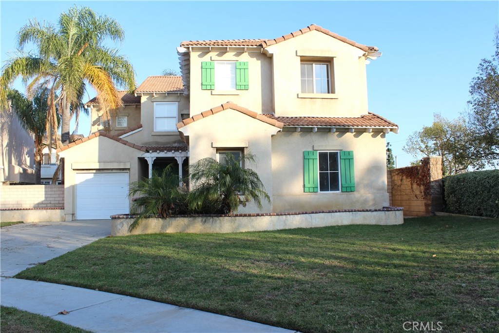 7881 Margaux Place Rancho Cucamonga, CA 91739 - Photo 2 of 41 a front view of a house with a garden and plants