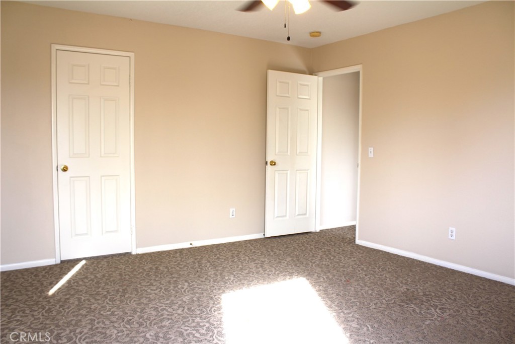 7881 Margaux Place Rancho Cucamonga, CA 91739 - Photo 21 of 41 an empty room with chandelier fan