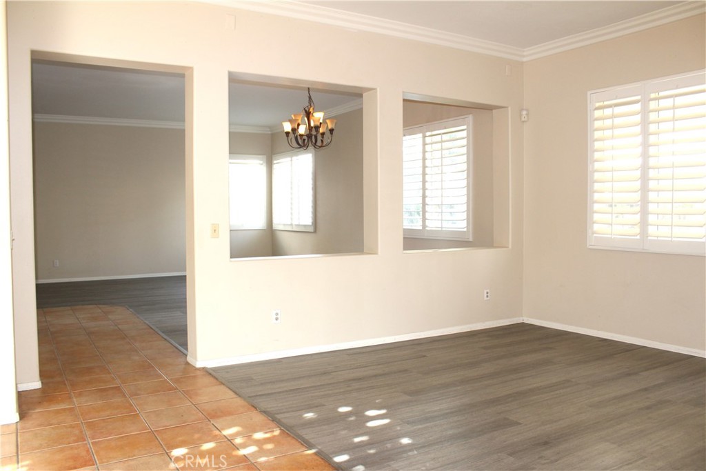 7881 Margaux Place Rancho Cucamonga, CA 91739 - Photo 5 of 41 an empty room with wooden floor and windows