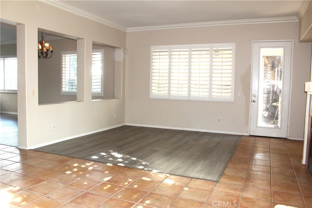 7881 Margaux Place Rancho Cucamonga, CA 91739 - Photo 6 of 41 a view of an empty room with wooden floor and a window