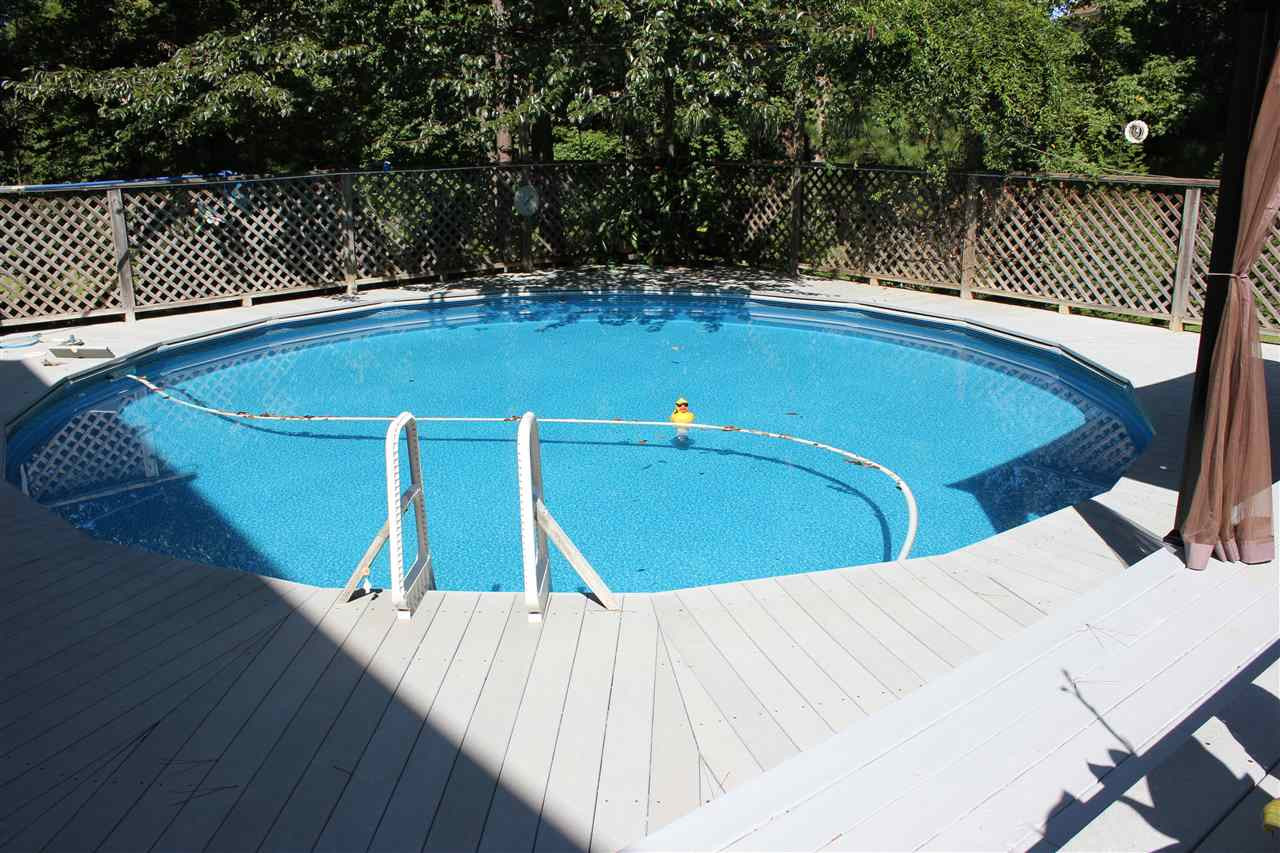 9504 Springdale Drive Raleigh, NC 27613 - Photo 20 of 25 Pool surrounded by Trex Decking