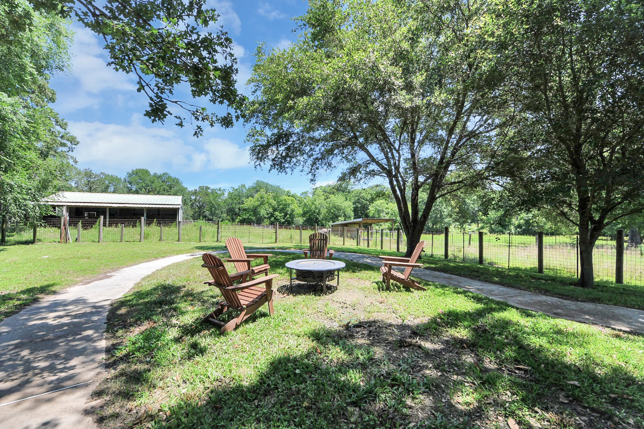 28222 Margerstadt Road Waller, TX 77484 - Photo 39 of 50 Scenic grounds blend natural beauty with practical improvements.