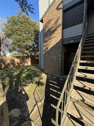 a view of an outdoor space and wooden fence