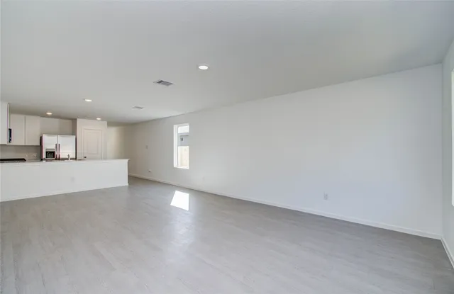a view of a kitchen with a sink and a window