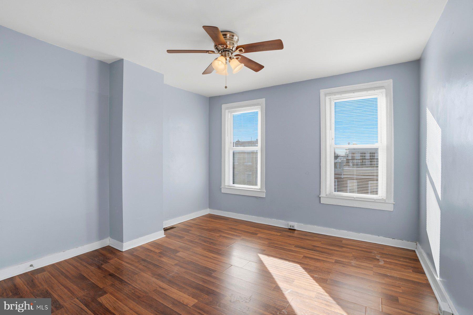 12 West Randall Street Baltimore, MD 21230 - Photo 8 of 28 a view of an empty room with window and wooden floor