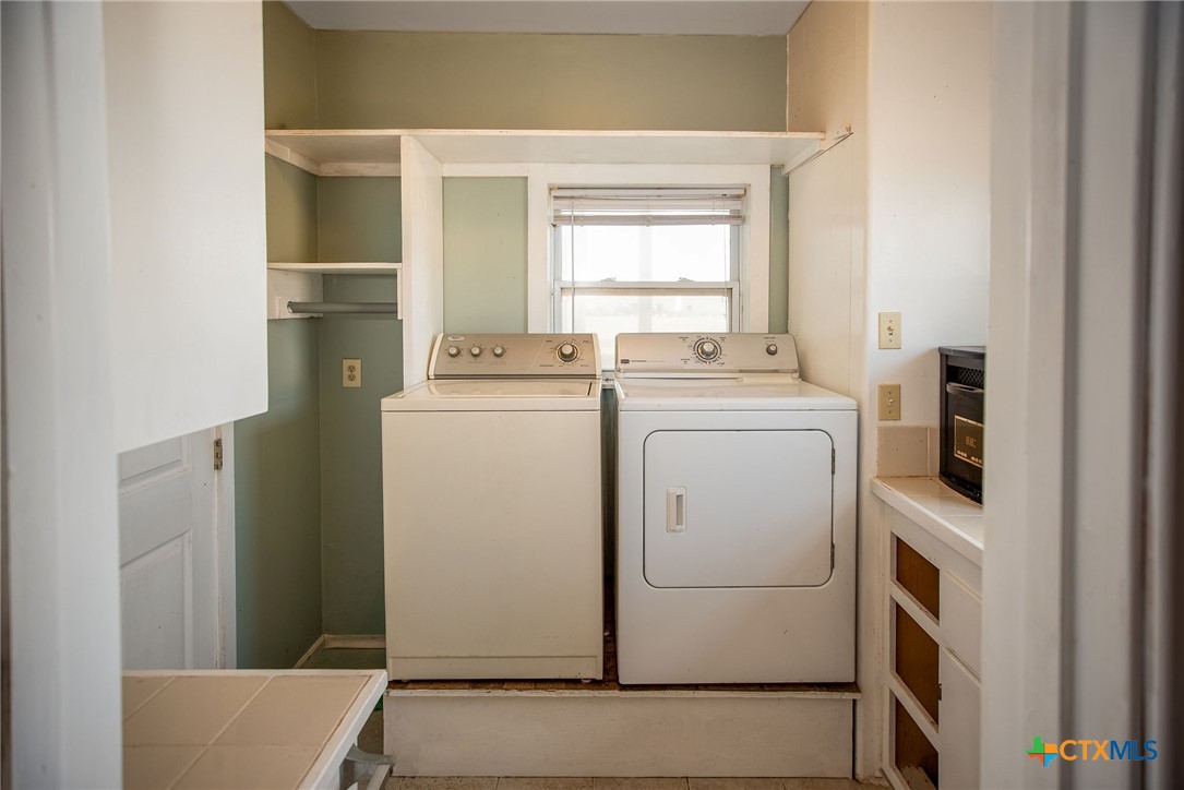 19 Dewberry Lane Seadrift, TX 77983 - Photo 31 of 40 Well-sized laundry room with ample space for chores and storage.