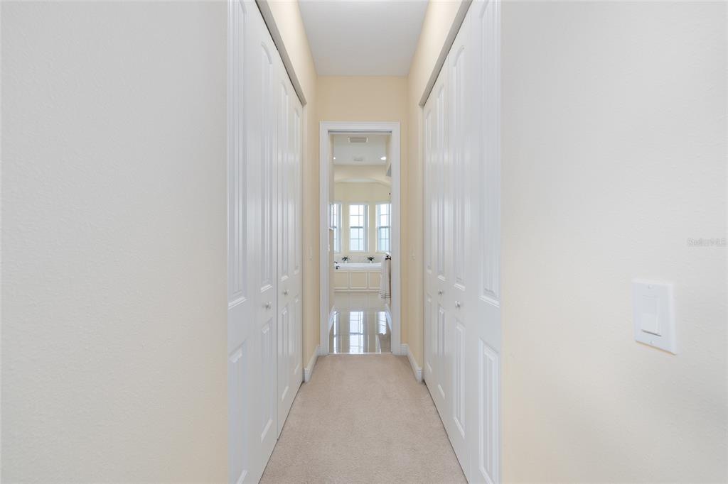 5024 Southwest 114th Street Road Ocala, FL 34476 - Photo 30 of 56 a view of a hallway with wooden floor and closet