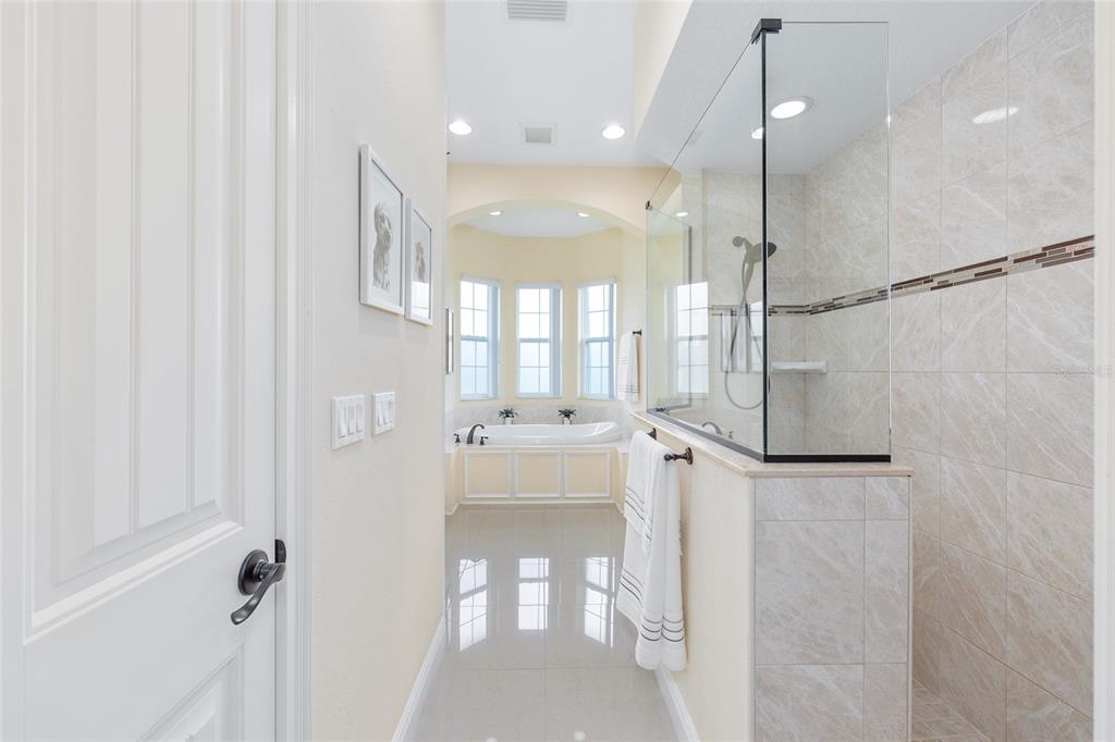 5024 Southwest 114th Street Road Ocala, FL 34476 - Photo 32 of 56 a bathroom with a glass shower door and a sink