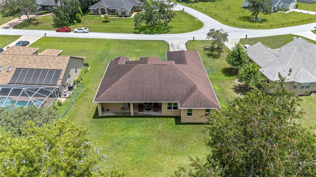 5024 Southwest 114th Street Road Ocala, FL 34476 - Photo 50 of 56 an aerial view of a house with a yard and lake view