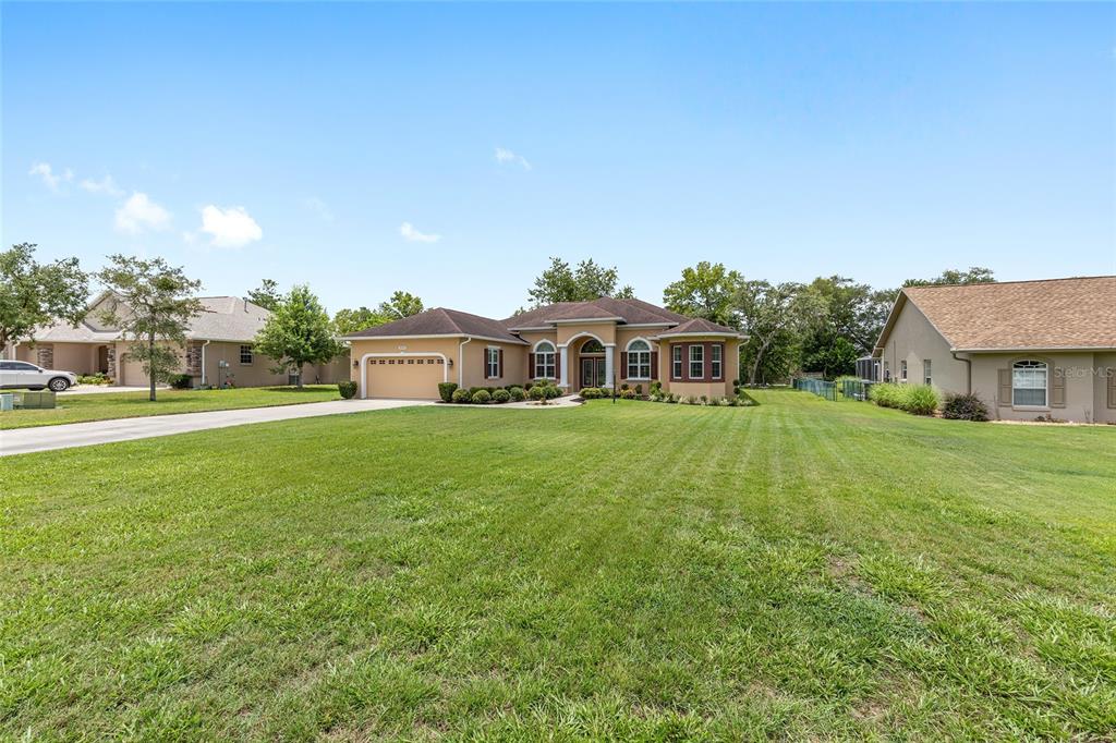 5024 Southwest 114th Street Road Ocala, FL 34476 - Photo 51 of 56 a house view with a garden space