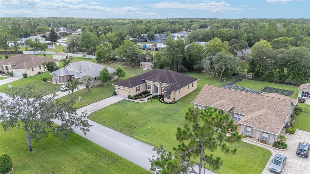 5024 Southwest 114th Street Road Ocala, FL 34476 - Photo 53 of 56 an aerial view of a house with garden