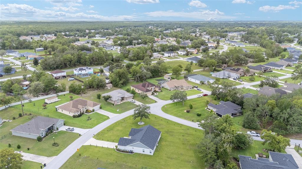 5024 Southwest 114th Street Road Ocala, FL 34476 - Photo 55 of 56 an aerial view of residential houses with outdoor space