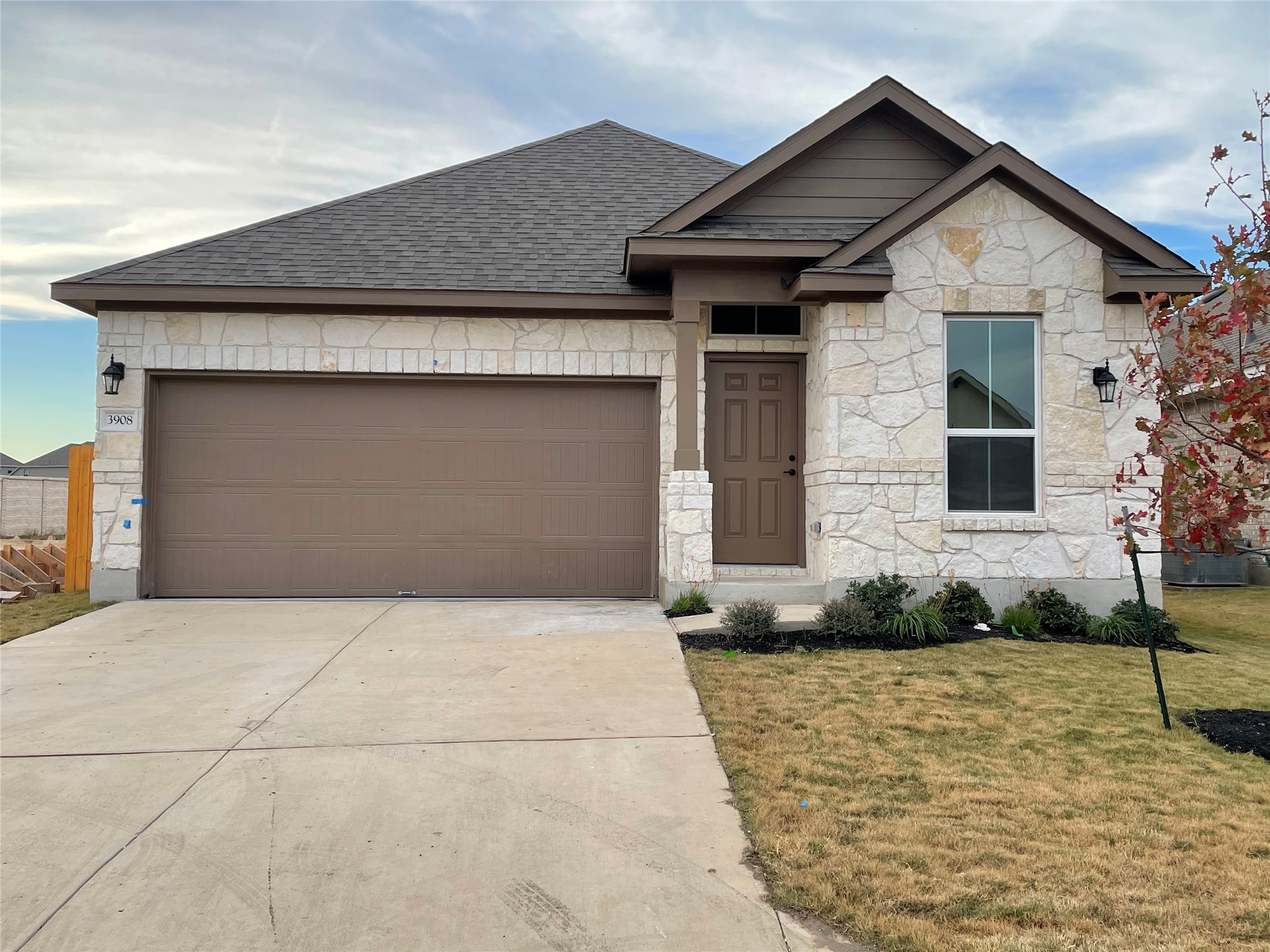 3908 Birdwatch Loop, Unit 56 Pflugerville, TX 78660 - Photo 1 of 30 a front view of a house with garden