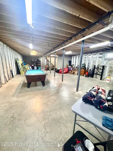 a bedroom with a bed and a television