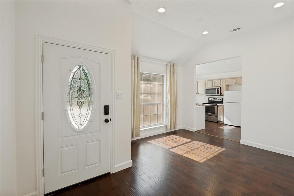 8160 Tower Road Frisco, TX 75035 - Photo 3 of 25 a view of a kitchen with wooden floor and window