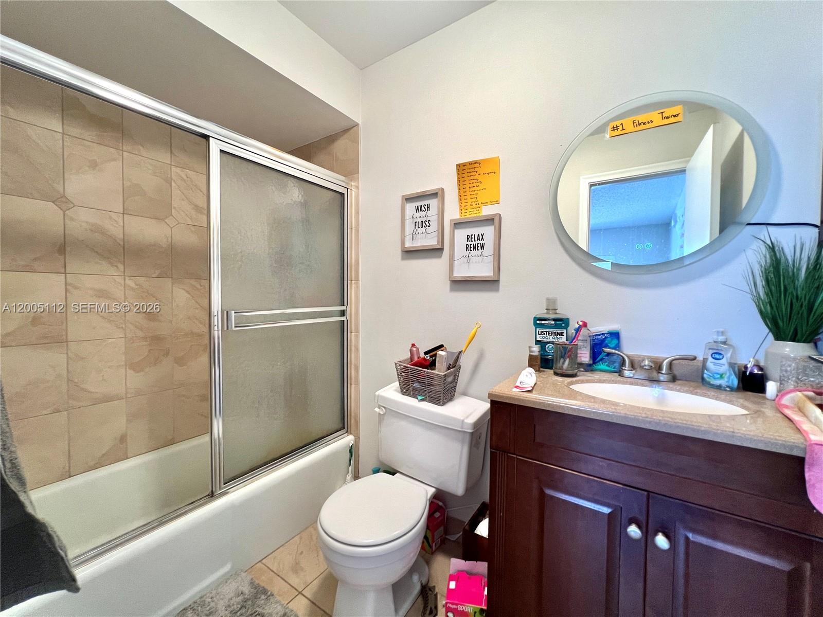 8114 Southwest 81st Terrace Miami, FL 33143 - Photo 15 of 20 a bathroom with a sink a toilet and shower