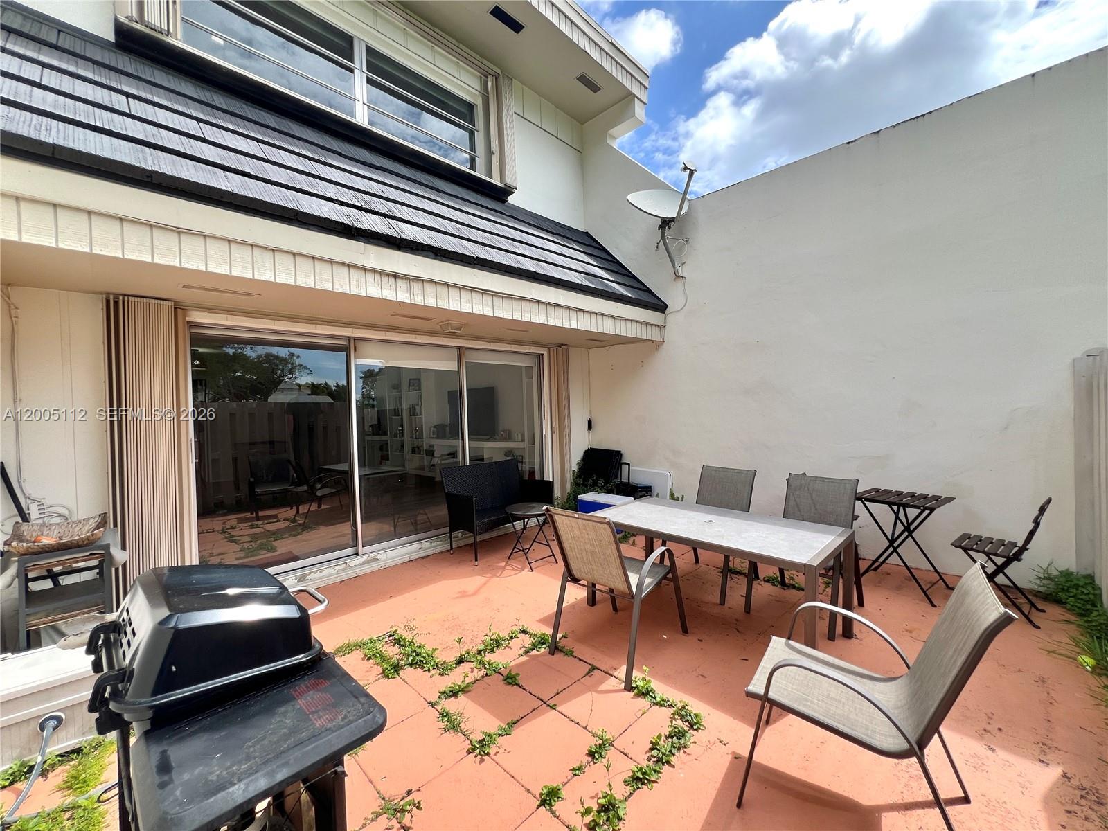 8114 Southwest 81st Terrace Miami, FL 33143 - Photo 20 of 20 a outdoor space with patio lots of furniture