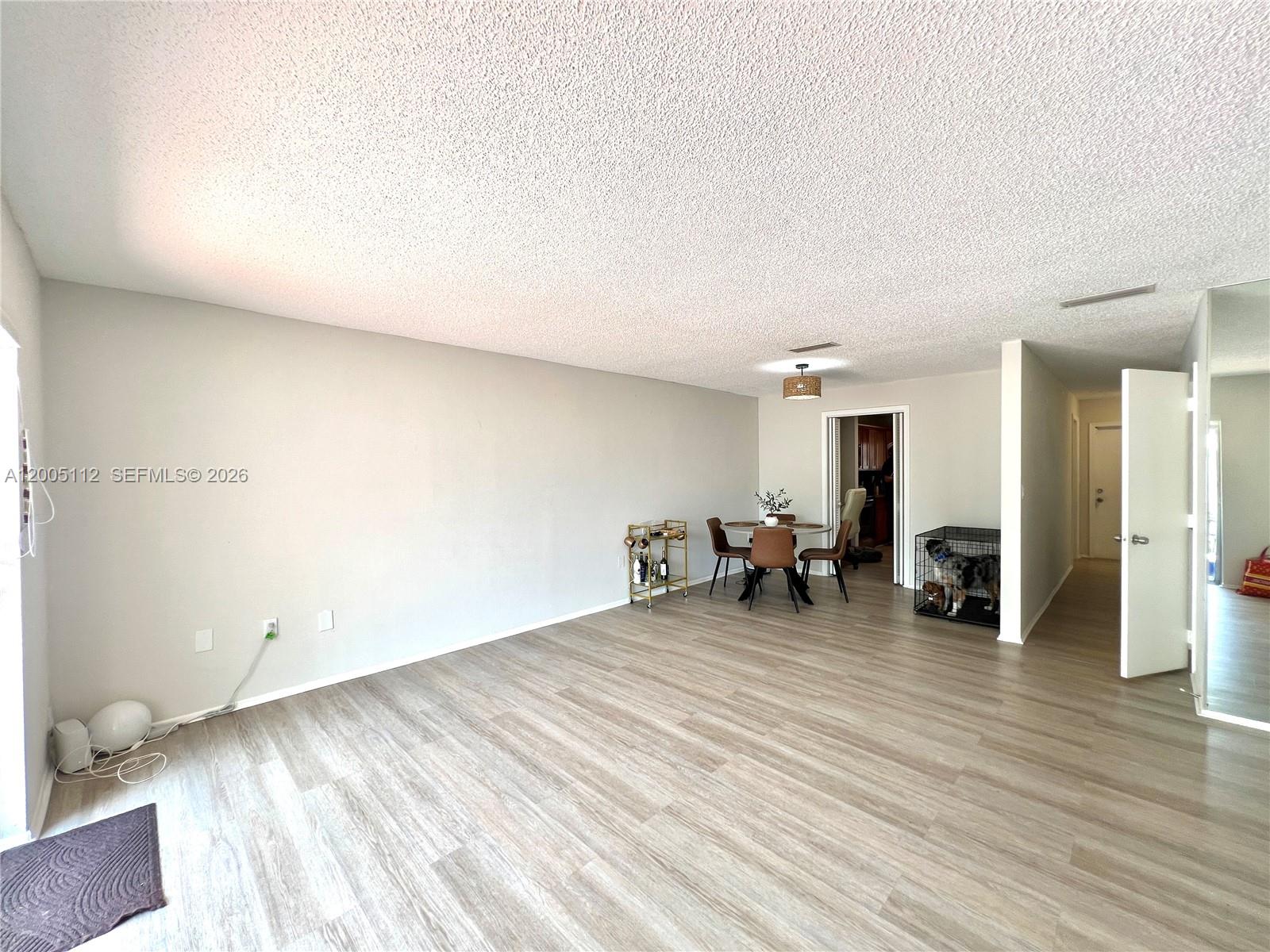 8114 Southwest 81st Terrace Miami, FL 33143 - Photo 3 of 20 a view of a room with wooden floor