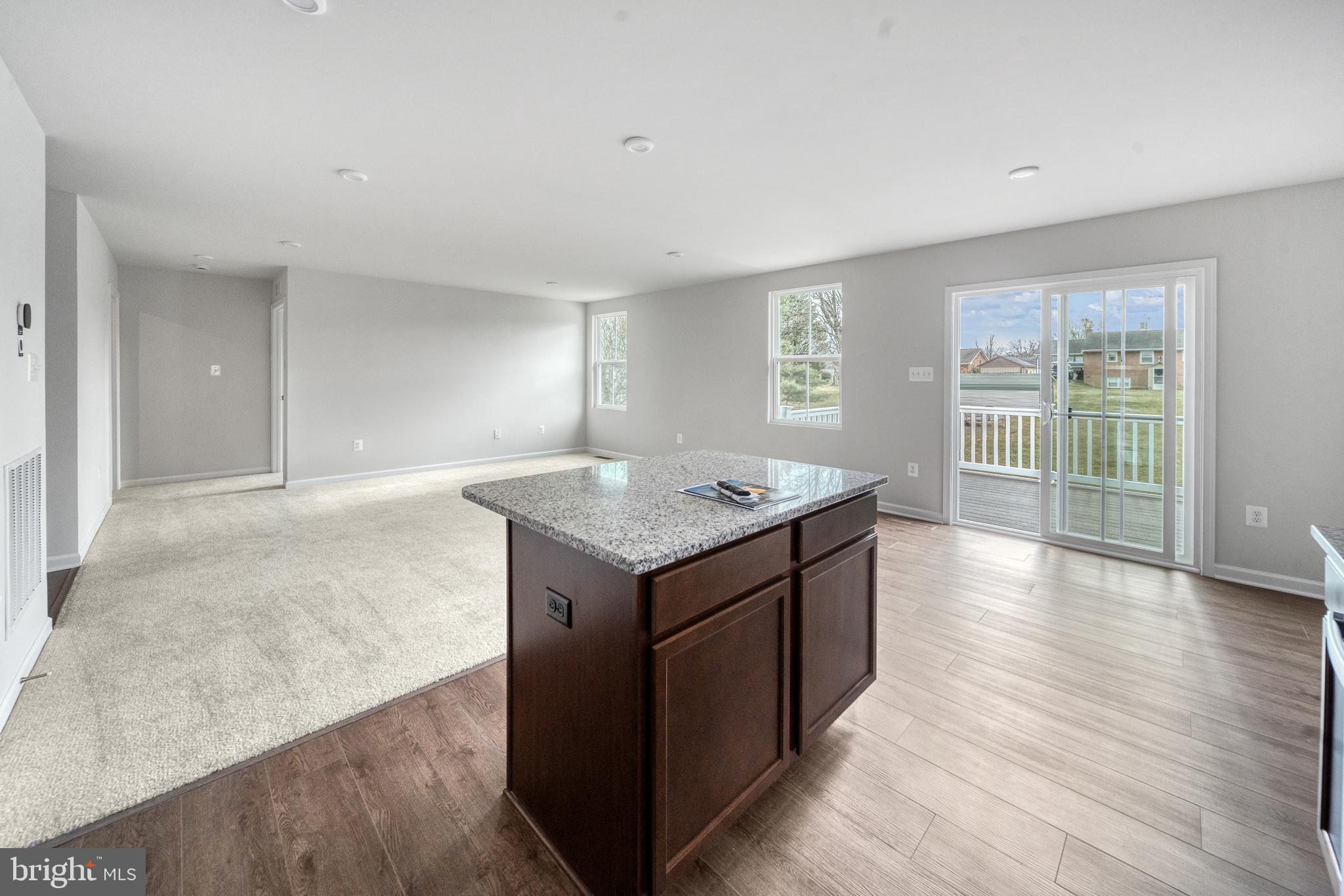 417 Circle Drive Winchester, VA 22601 - Photo 11 of 33 an empty room with wooden floor and windows
