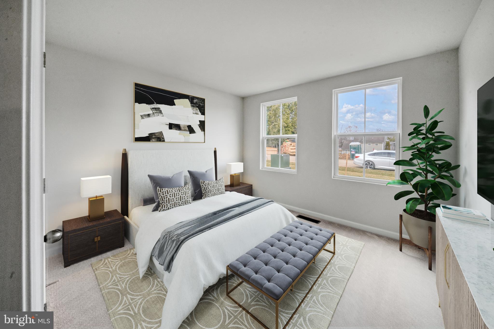 417 Circle Drive Winchester, VA 22601 - Photo 16 of 33 a bedroom with a bed and a potted plant