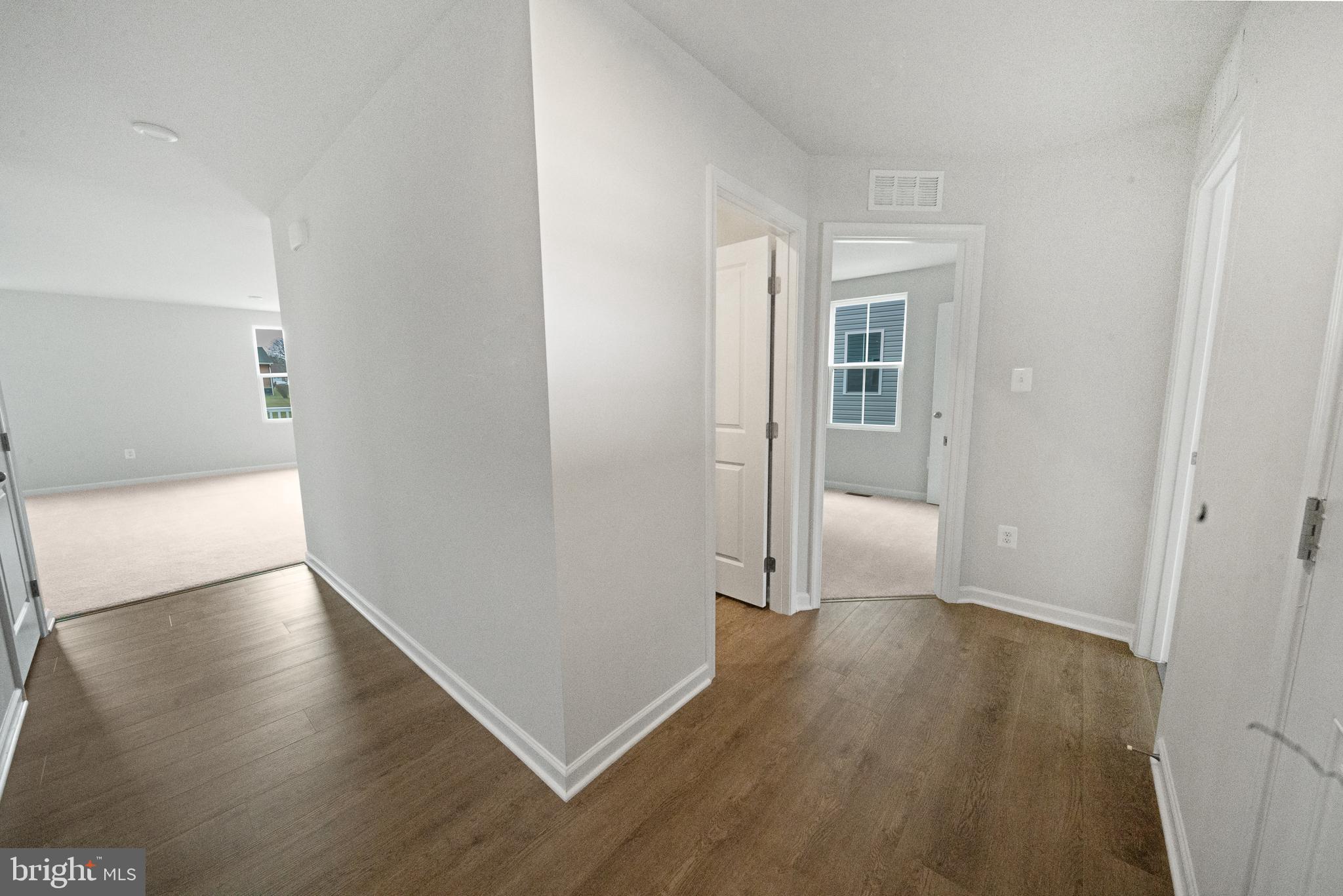 417 Circle Drive Winchester, VA 22601 - Photo 18 of 33 an empty room with wooden floor and windows
