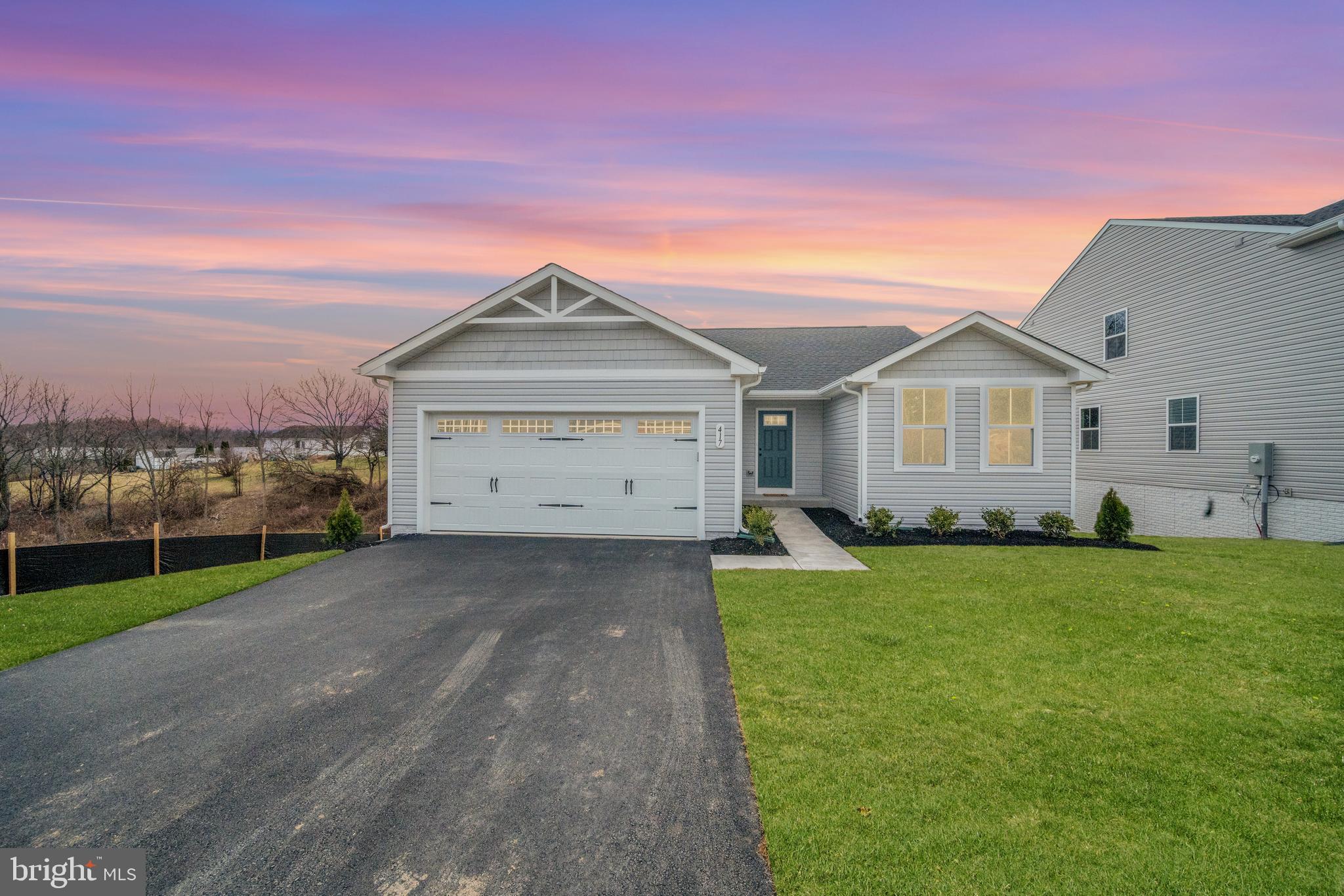 417 Circle Drive Winchester, VA 22601 - Photo 2 of 33 a front view of a house with a yard and garage