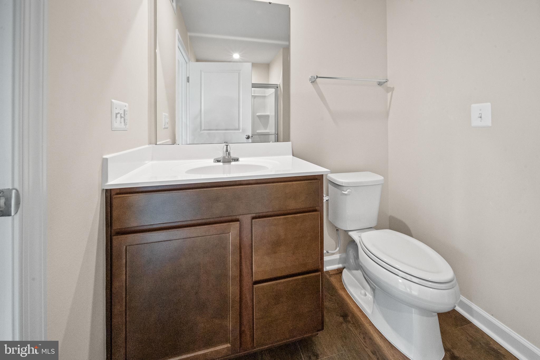417 Circle Drive Winchester, VA 22601 - Photo 22 of 33 a bathroom with a toilet a sink and a mirror