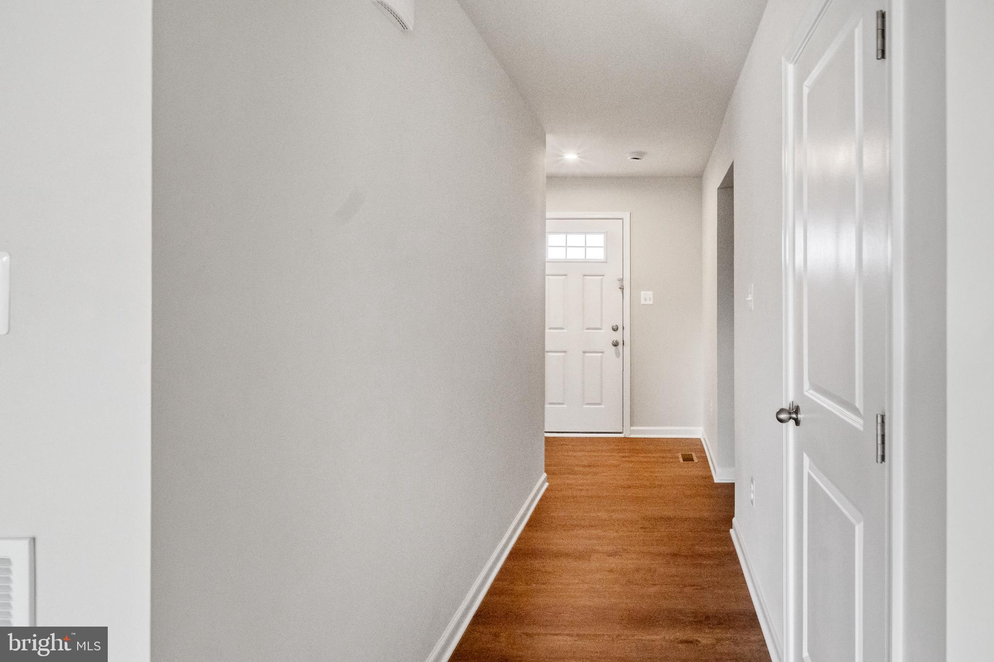 417 Circle Drive Winchester, VA 22601 - Photo 3 of 33 a view of a hallway with wooden floor