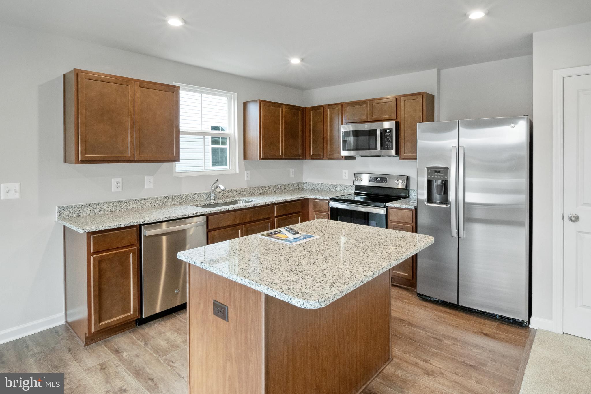 417 Circle Drive Winchester, VA 22601 - Photo 9 of 33 a kitchen with stainless steel appliances granite countertop refrigerator sink and microwave