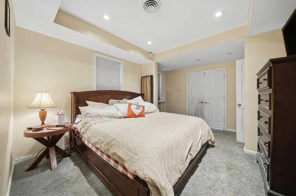 237 Grandview Avenue Pittsburgh, PA 15211 - Photo 20 of 43 a bedroom with a bed and a lamp
