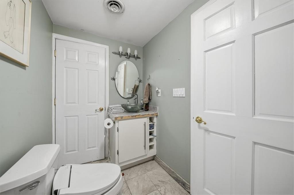 237 Grandview Avenue Pittsburgh, PA 15211 - Photo 22 of 43 a bathroom with a toilet a sink and a mirror