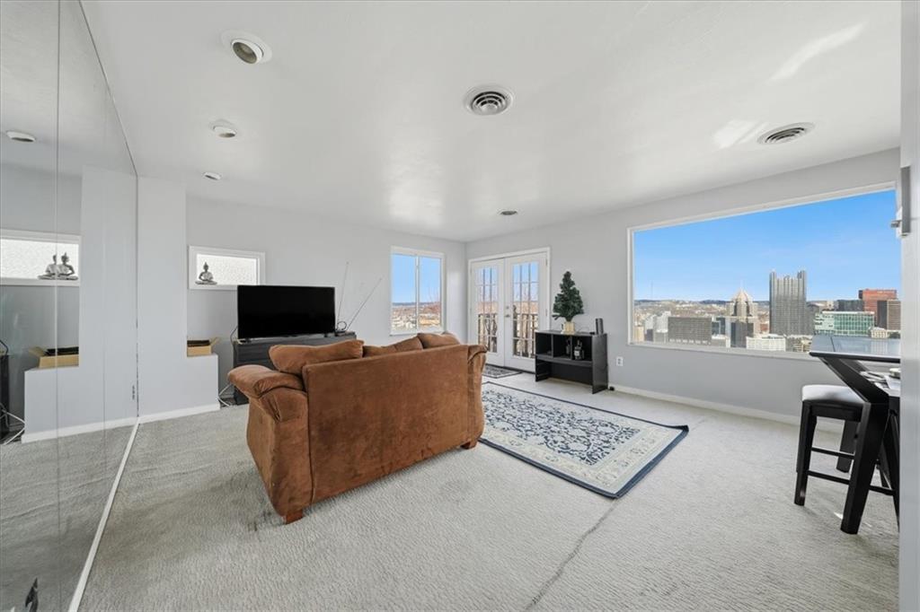 237 Grandview Avenue Pittsburgh, PA 15211 - Photo 27 of 43 a living room with furniture and a flat screen tv
