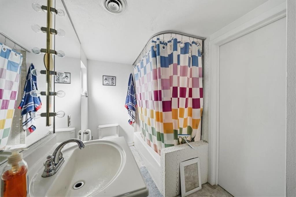 237 Grandview Avenue Pittsburgh, PA 15211 - Photo 36 of 43 a bathroom with a sink and a mirror