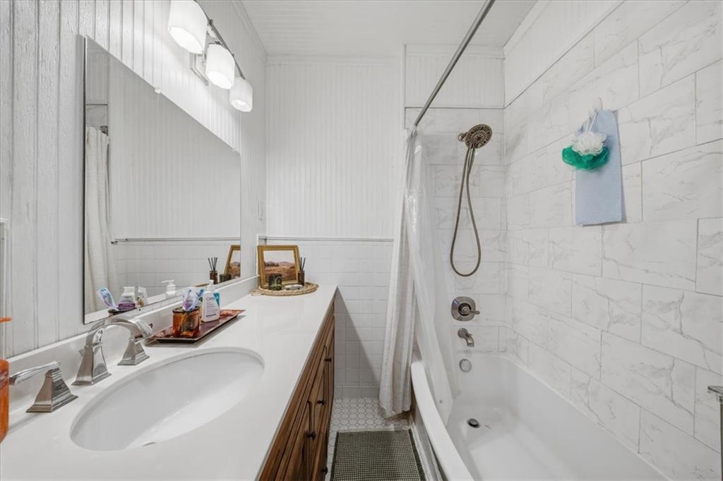 237 Grandview Avenue Pittsburgh, PA 15211 - Photo 10 of 43 a bathroom with a tub sink and mirror