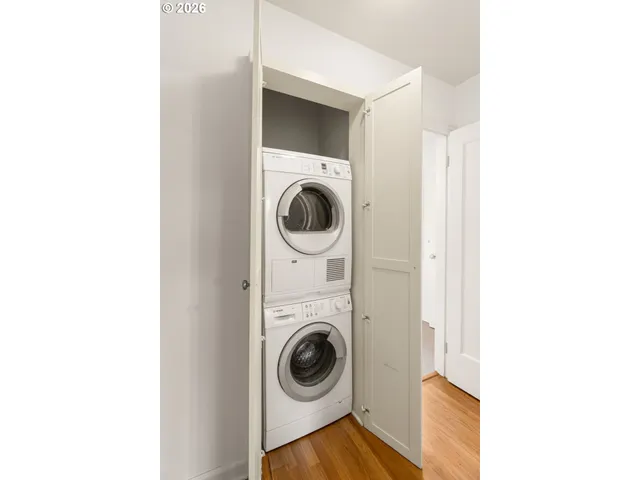 a view of a hallway with washer and dryer