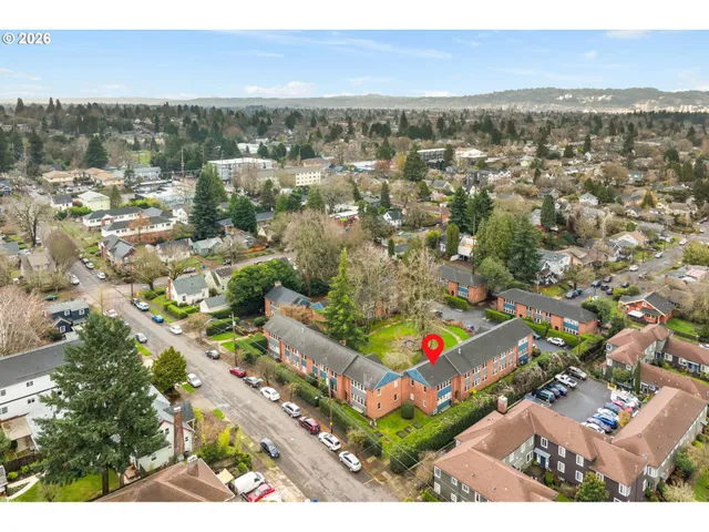 an aerial view of multiple house with yard
