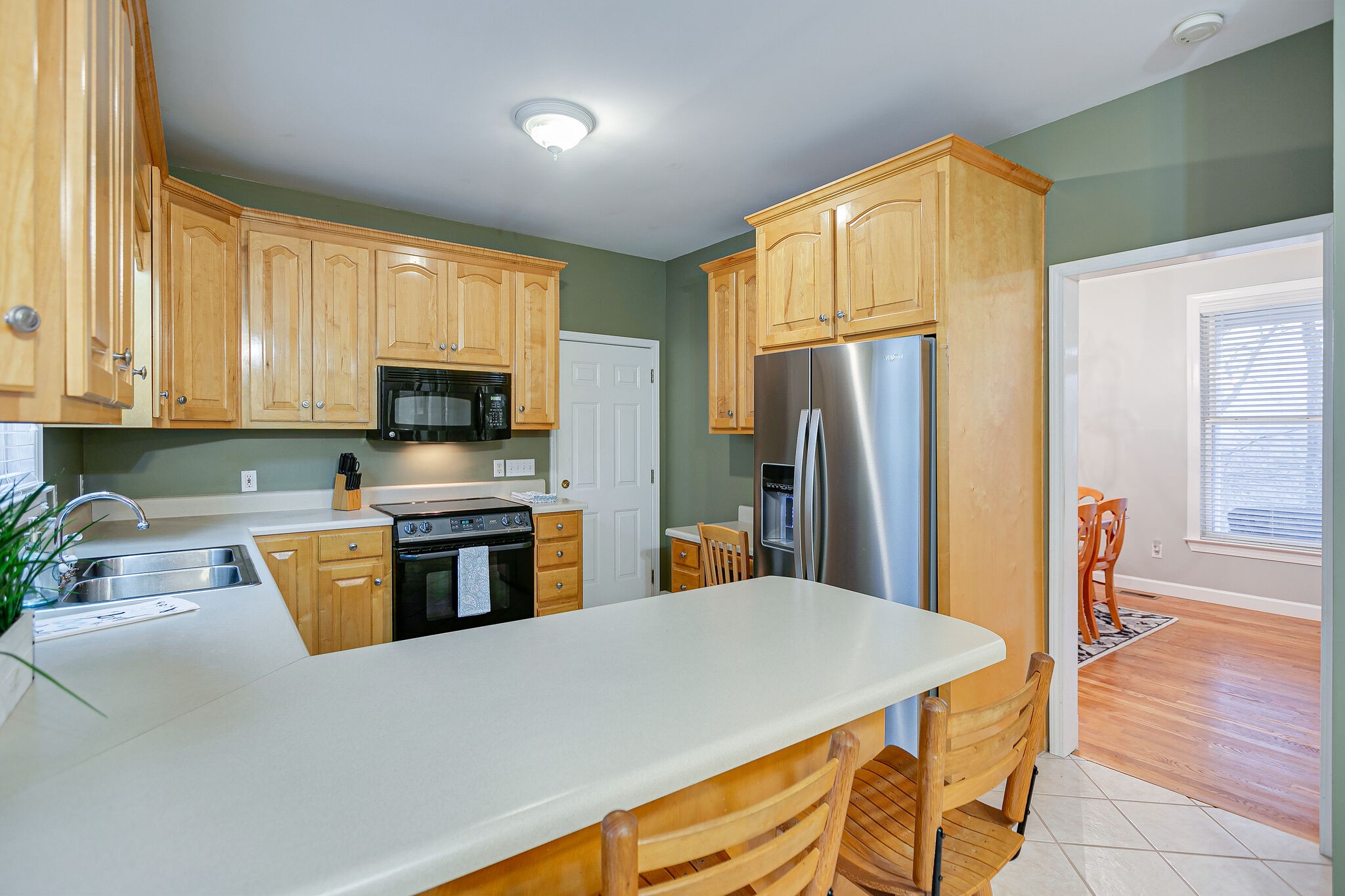 4311 Peytonsville-Trinity Road Franklin, TN 37064 - Photo 13 of 32 a kitchen with stainless steel appliances a refrigerator stove microwave and sink