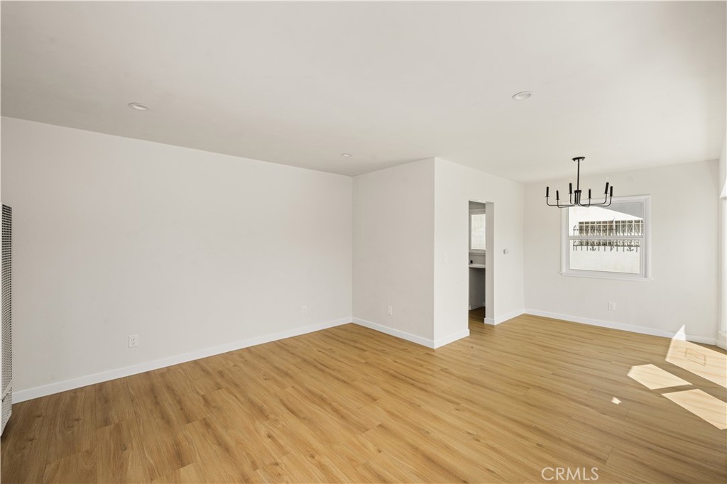 1013 West 138th Street Compton, CA 90222 - Photo 4 of 30 a view of empty room with wooden floor
