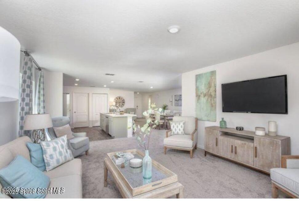 1190 Sandusky Street Southeast Palm Bay, FL 32909 - Photo 6 of 11 a living room with furniture and a flat screen tv