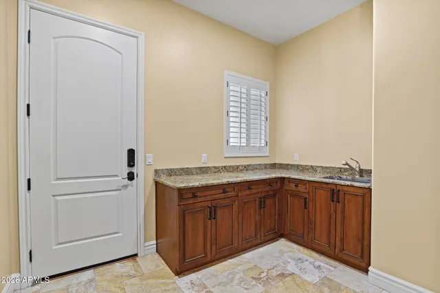 a utility room with a sink washer and dryer