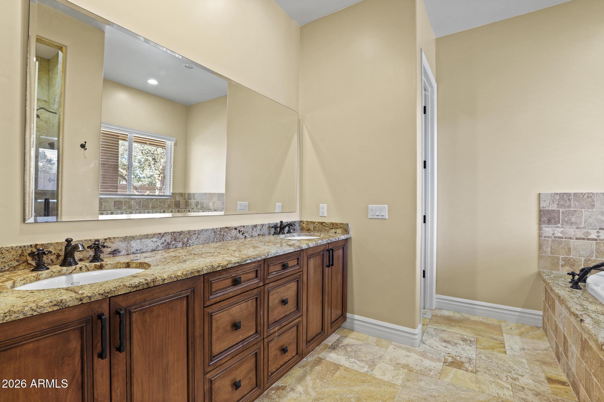 7705 Caballero Road Payson, AZ 85541 - Photo 20 of 43 a bathroom with a granite countertop sink and a mirror