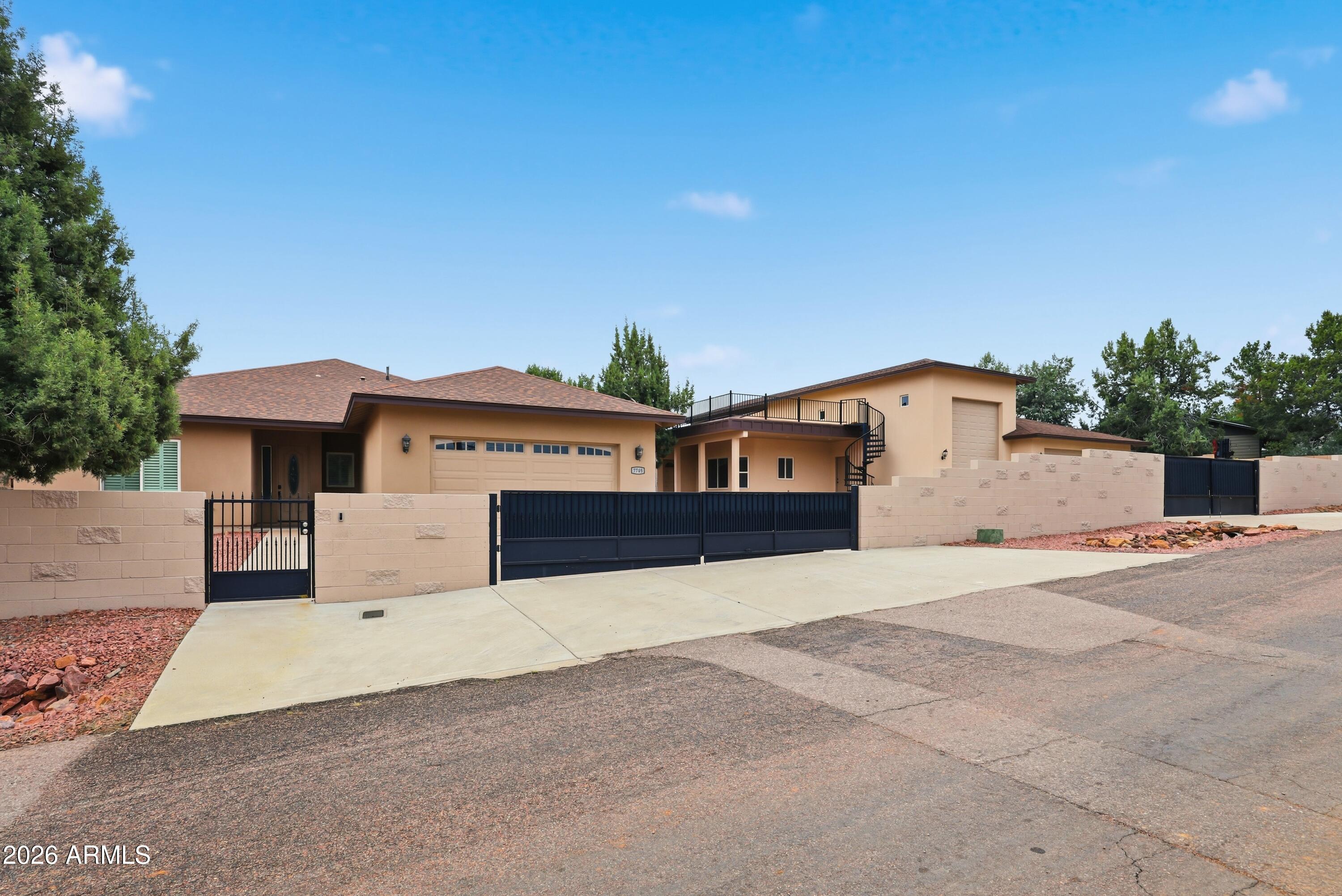 7705 Caballero Road Payson, AZ 85541 - Photo 2 of 43 a front view of a house with a yard