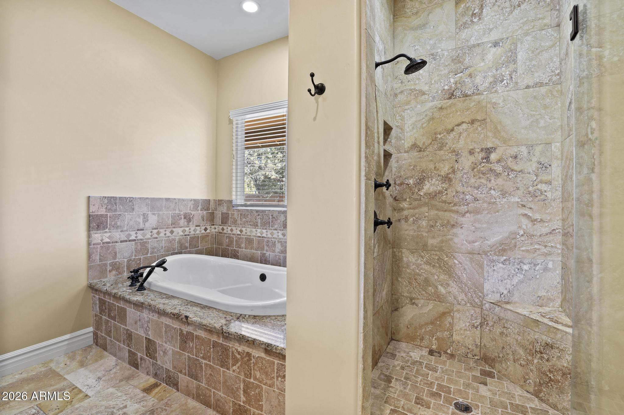 7705 Caballero Road Payson, AZ 85541 - Photo 21 of 43 a bathroom with a bathtub and shower