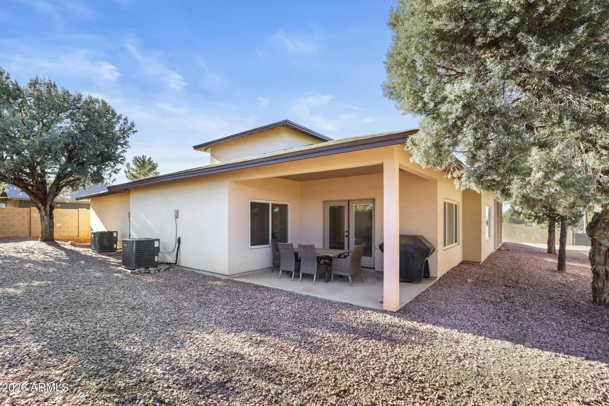 7705 Caballero Road Payson, AZ 85541 - Photo 40 of 43 a backyard of a house with table and chairs