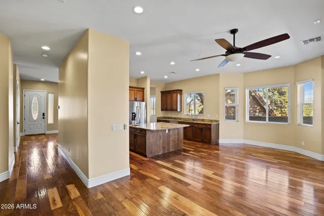 a view of kitchen with cabinets and wooden floor