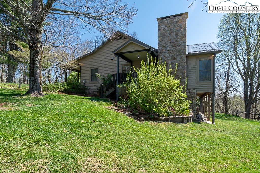 658 Rainbow Mountain Road Boone, NC 28607 - Photo 3 of 28 a front view of house with a garden