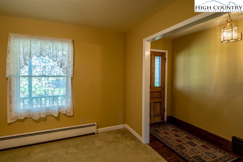 658 Rainbow Mountain Road Boone, NC 28607 - Photo 8 of 28 a view of an empty room and window